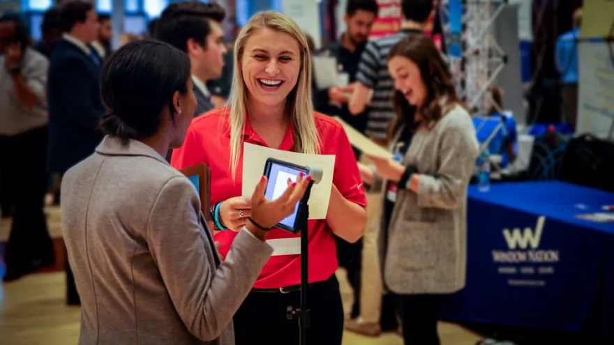 A student and recruiter chat during a careers event