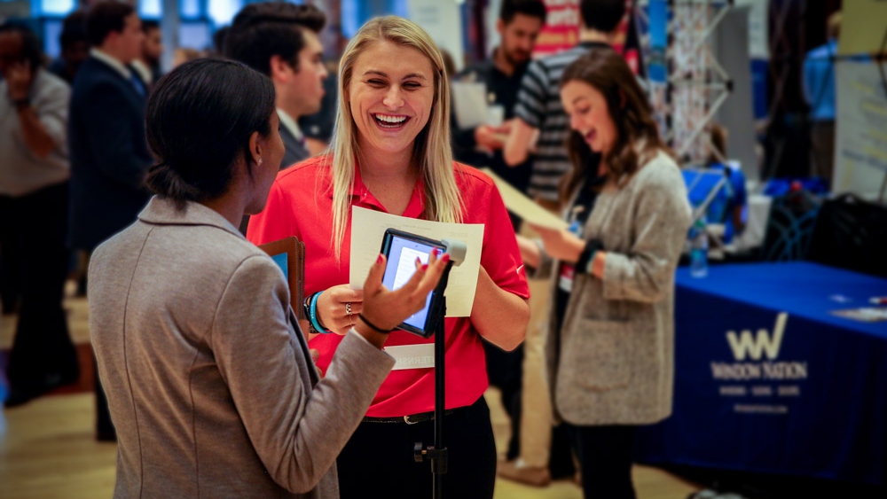 A student and recruiter chat during a careers event