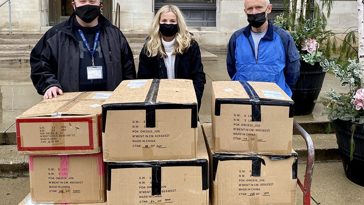 PHSLC President Madison Conley (center) delivers coats with Scioto County probation officers Jason Johnson (left) and Chuck Law (right).