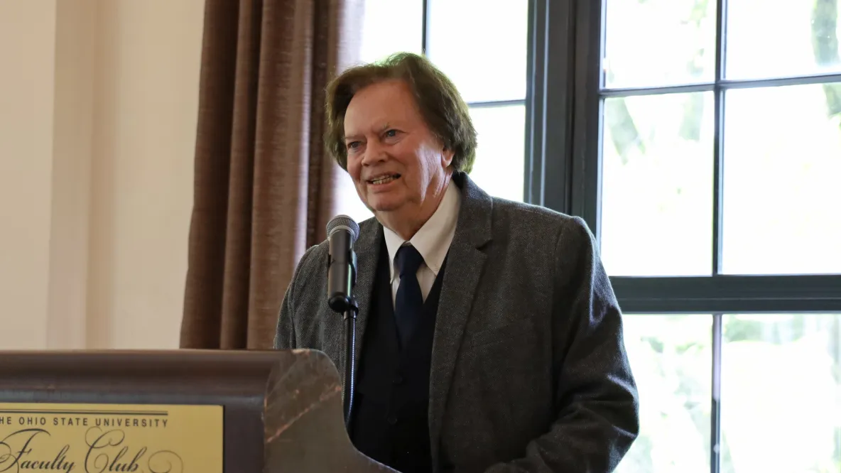 Randall Harris stands behind a lectern.