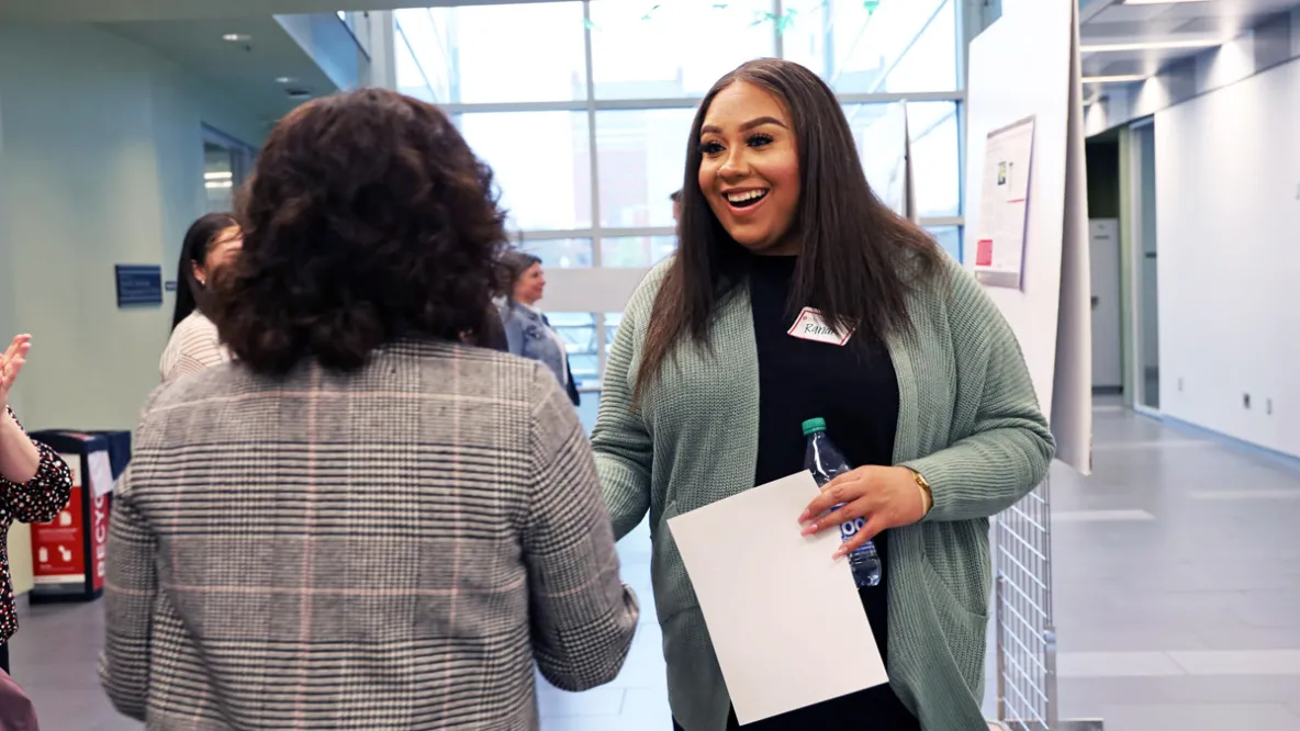 Grad student joyfully reacts to winning college's poster competition