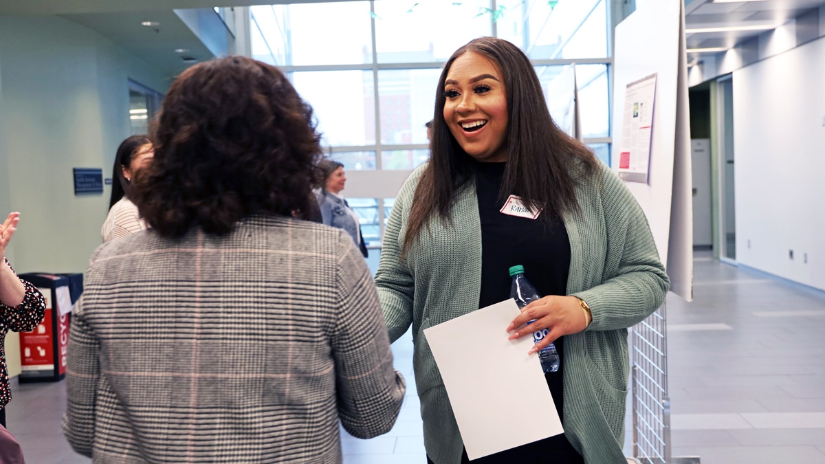 Grad student joyfully reacts to winning college's poster competition