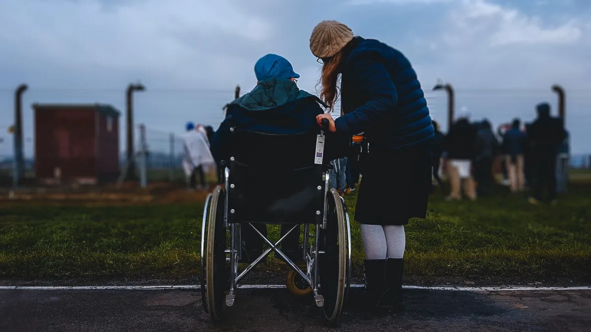 caregiver with person in wheelchair