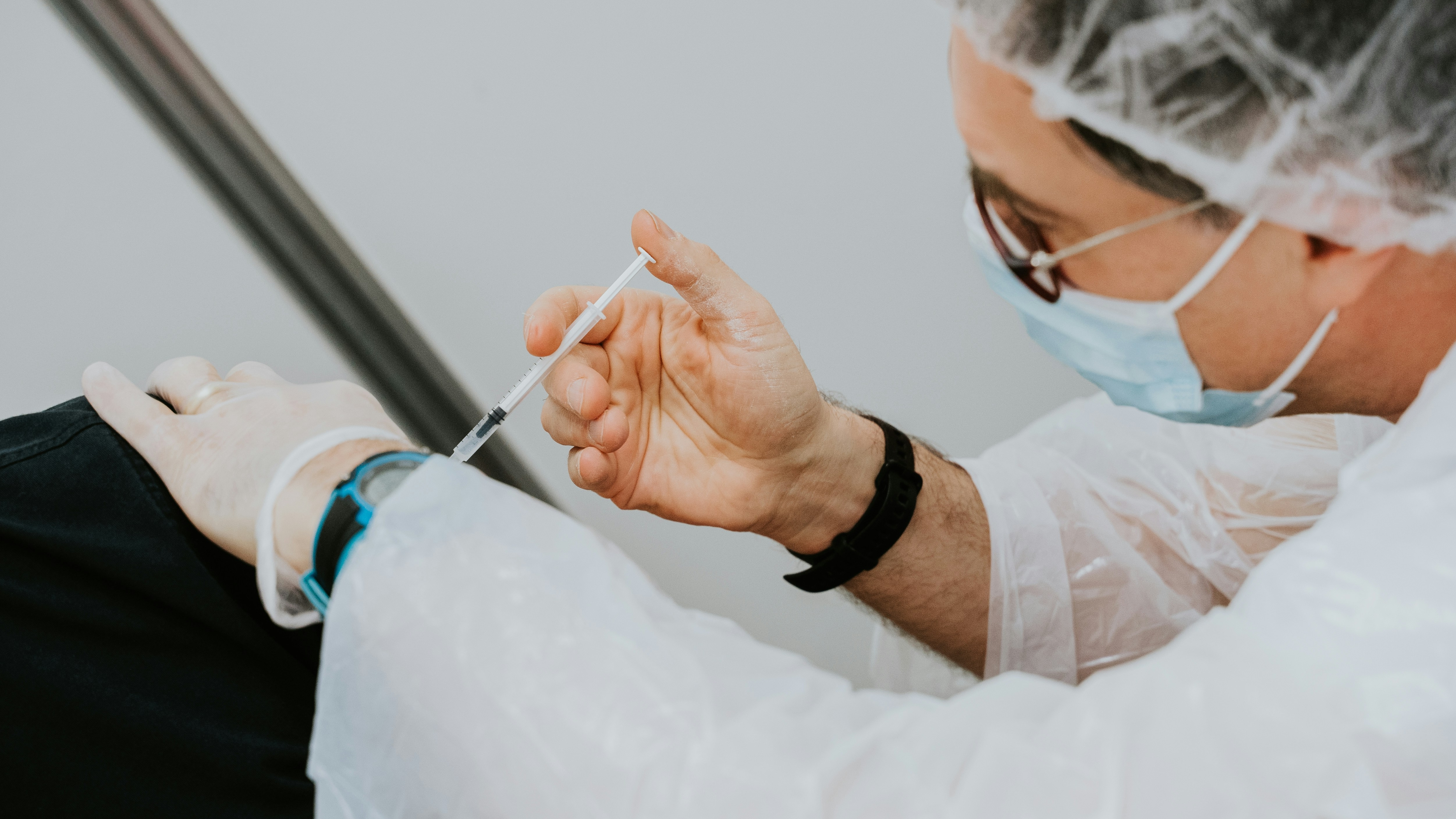 A health care provider administers a vaccine.