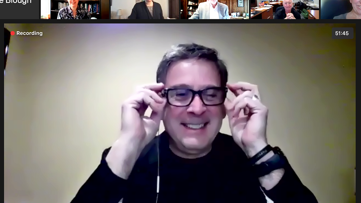Mike Bisesi spotlit in a zoom meeting with university leadership