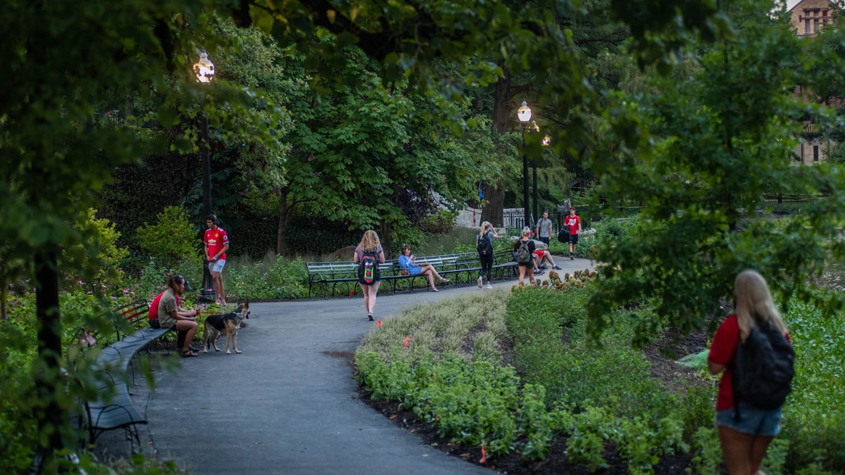 Students walk along Mirror Lake on Ohio State's Columbus campus