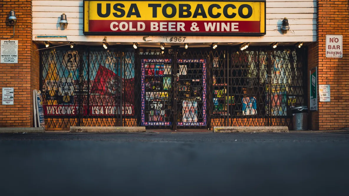 The outside of a USA Tobacco store that says "Cold Beer & Wine" on the sign. 