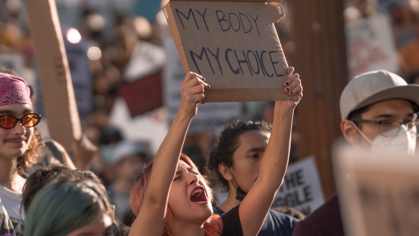 a protester holds a "my body my choice sign."