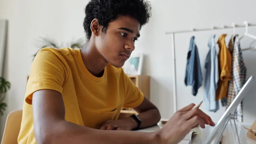 young man using laptop