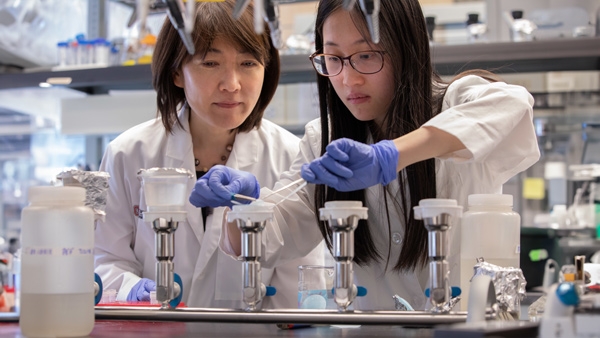 Professor and student test water samples
