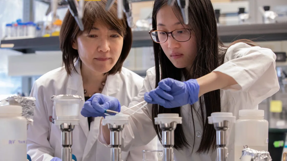 Professor and student test water samples