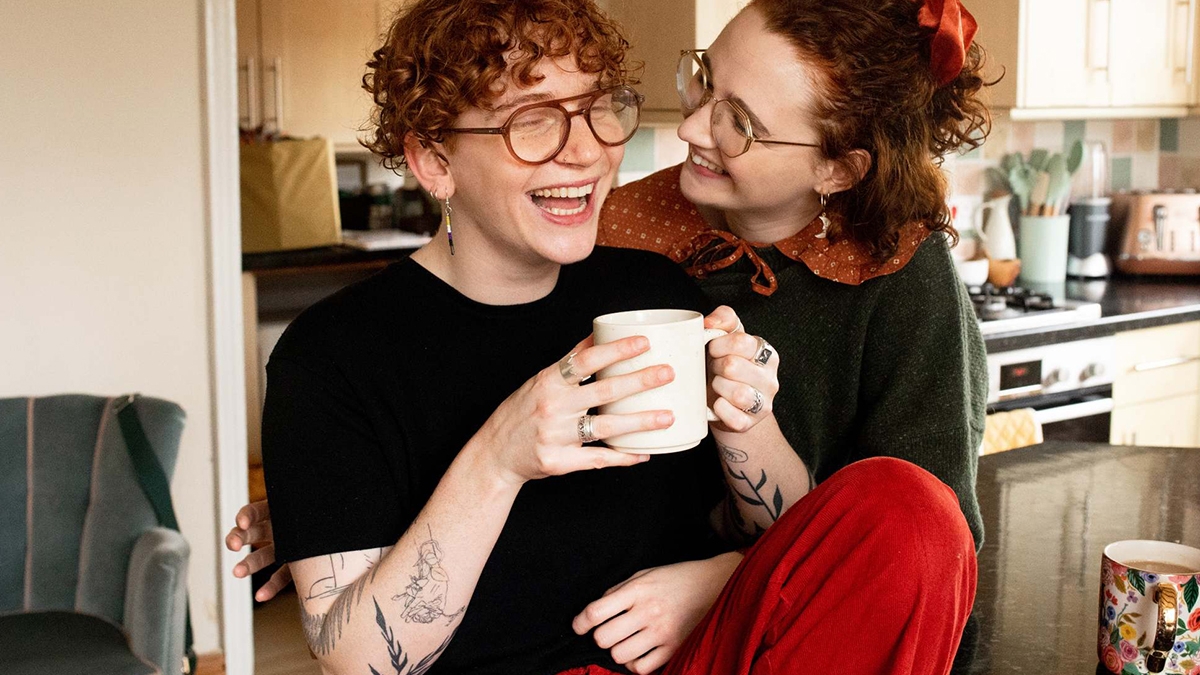 Queer couple laughing