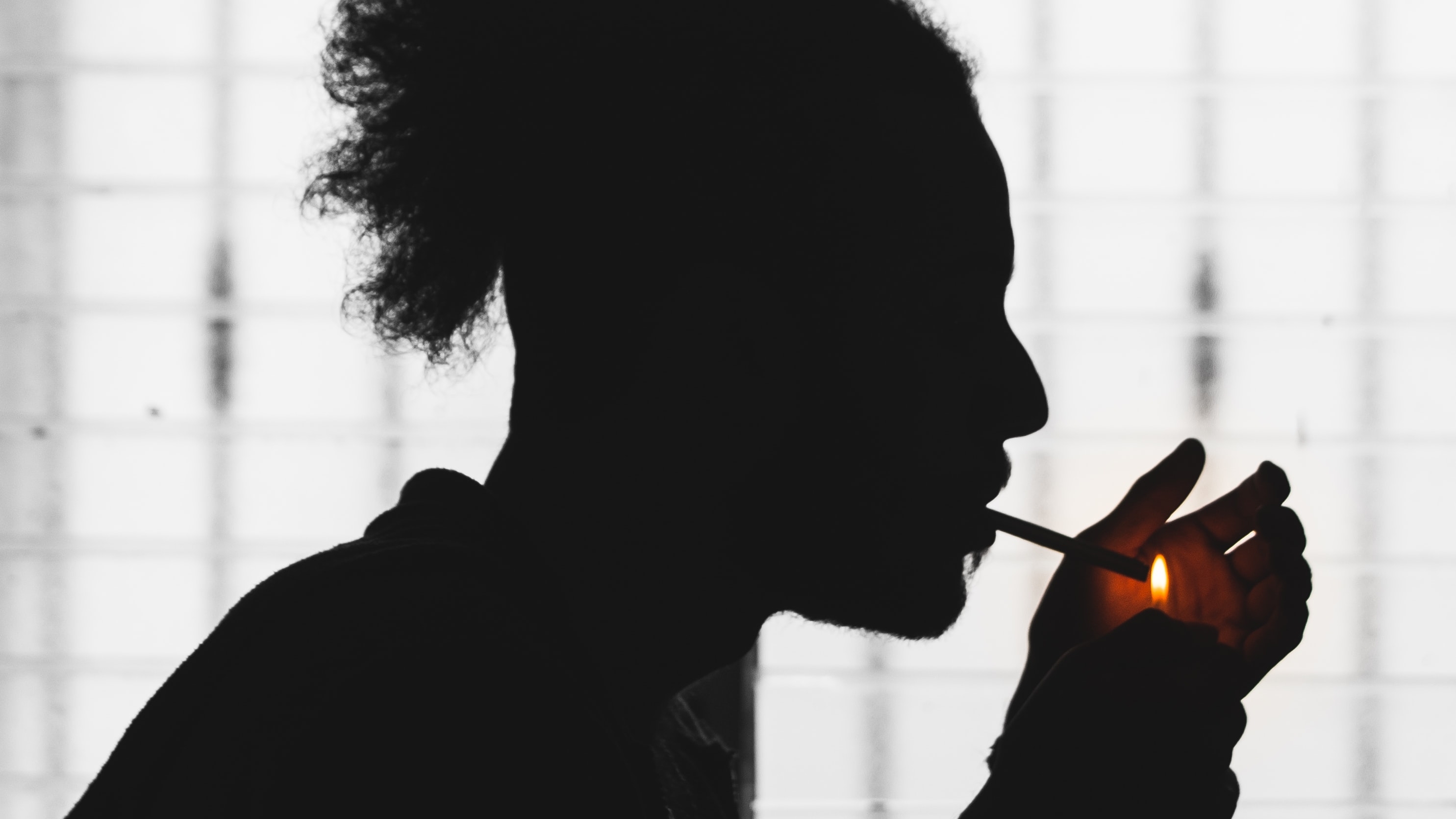 Young man smoking a cigarette