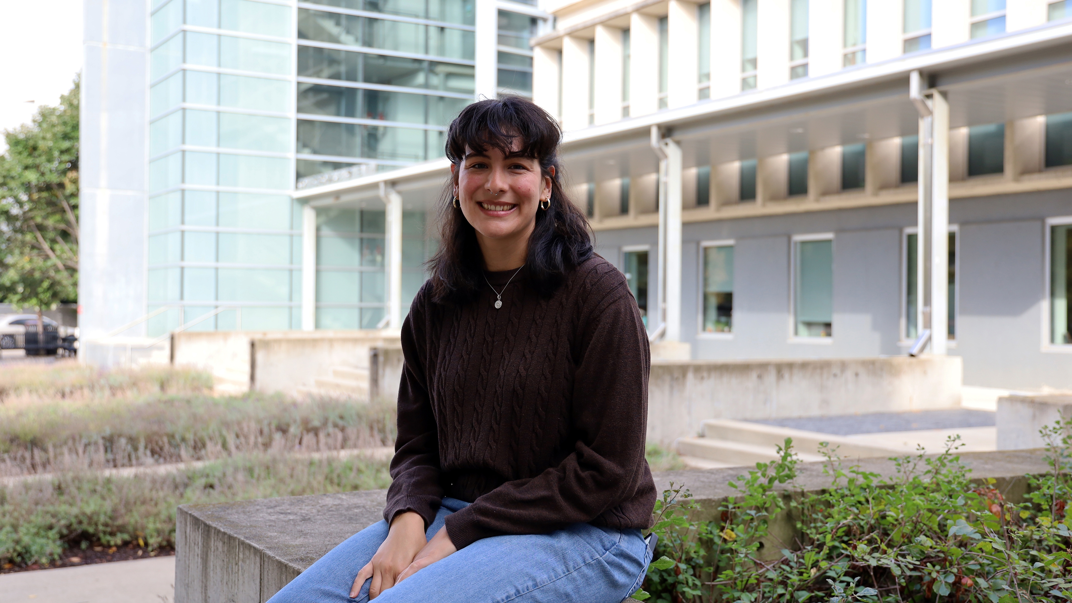 Micaela Richter smiles for a photo in front of Cunz Hall.