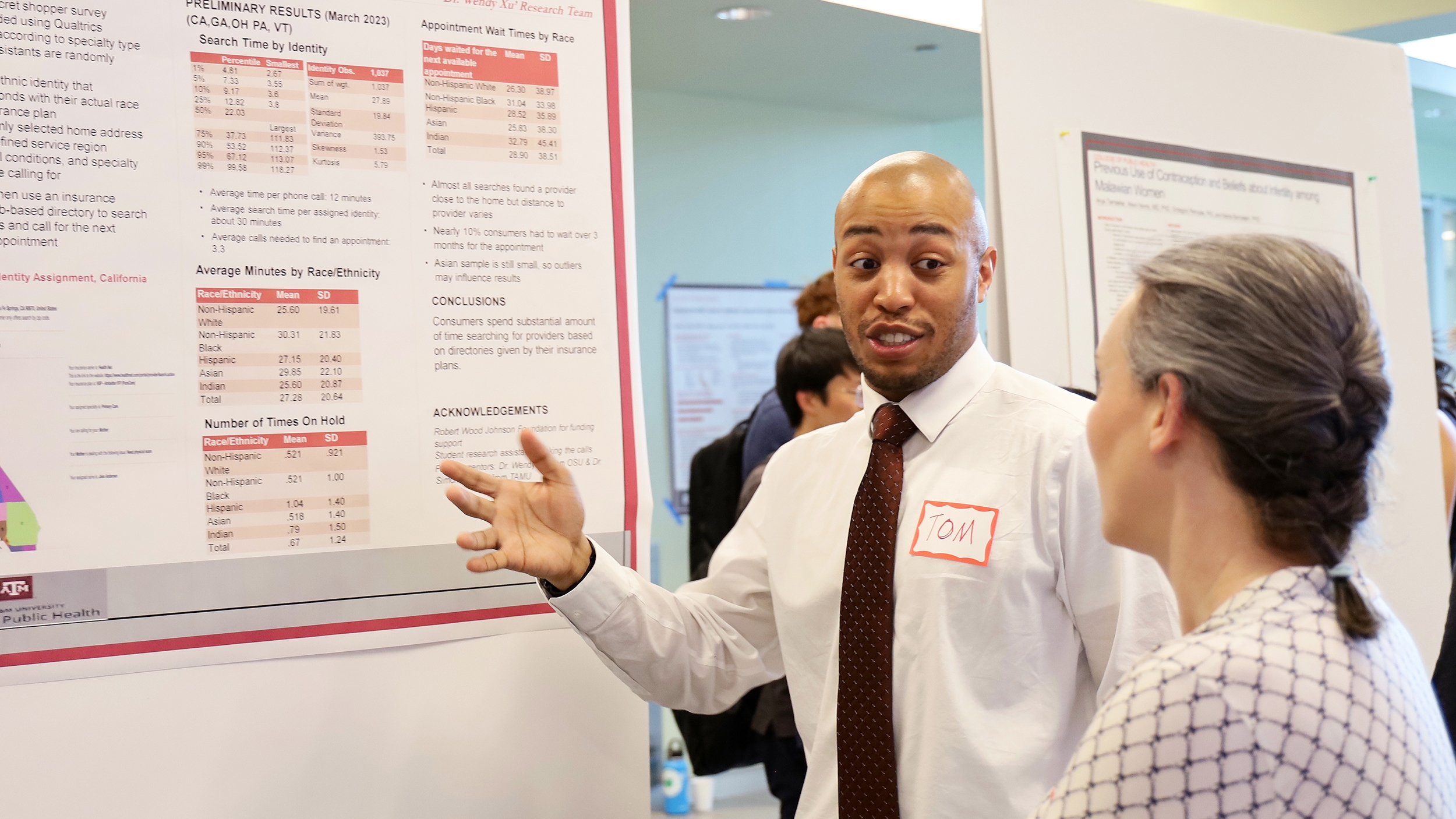 Thomas Elton presents a poster during CPH Poster Day