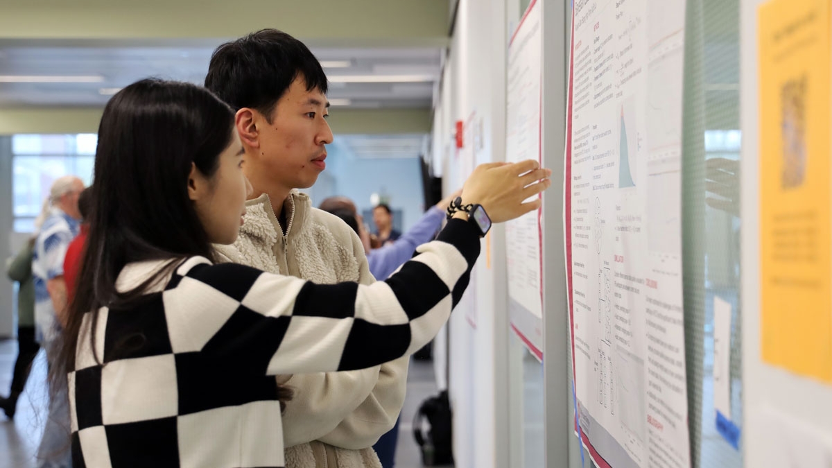 Two students talk about a research project