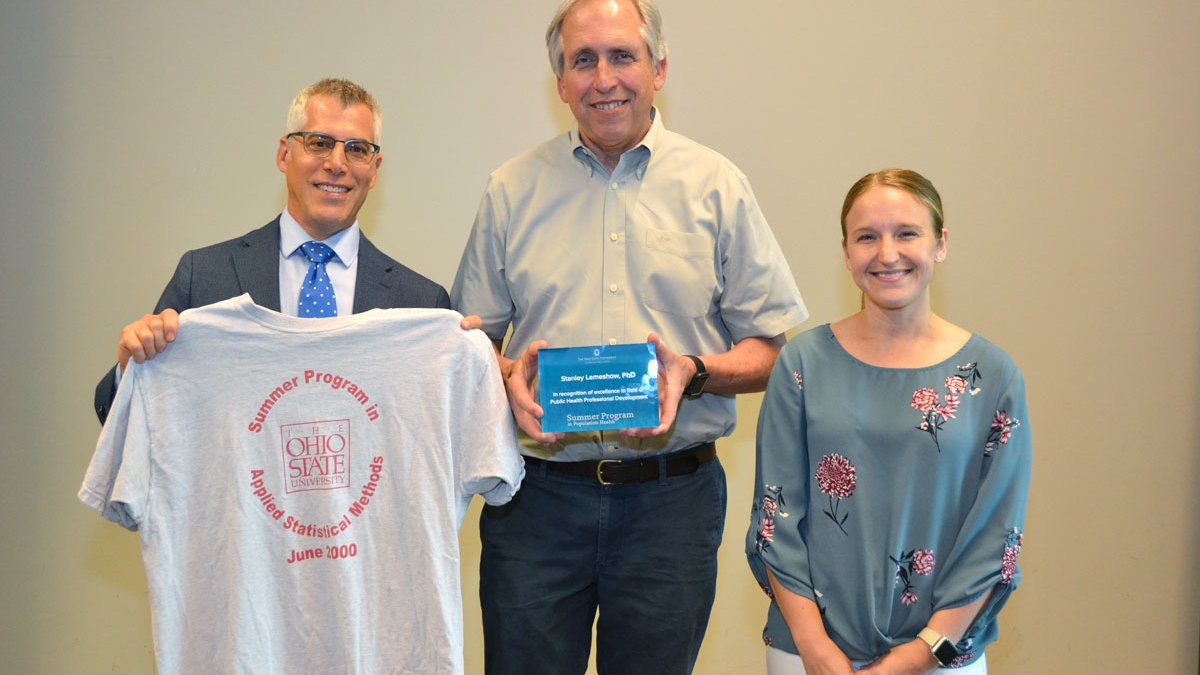 Stanley Lemeshow (center), professor of biostatistics and founding dean of CPH, received an award by CPHP director Andy Wapner and program manager Colleen Fitzgibbons.