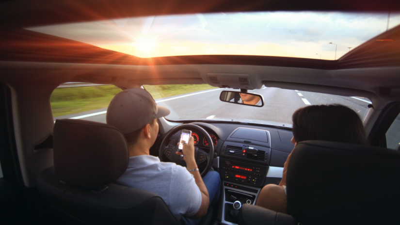 person texting while driving