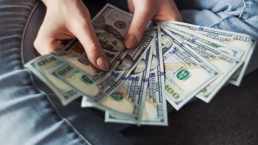 100-dollar bills spread
