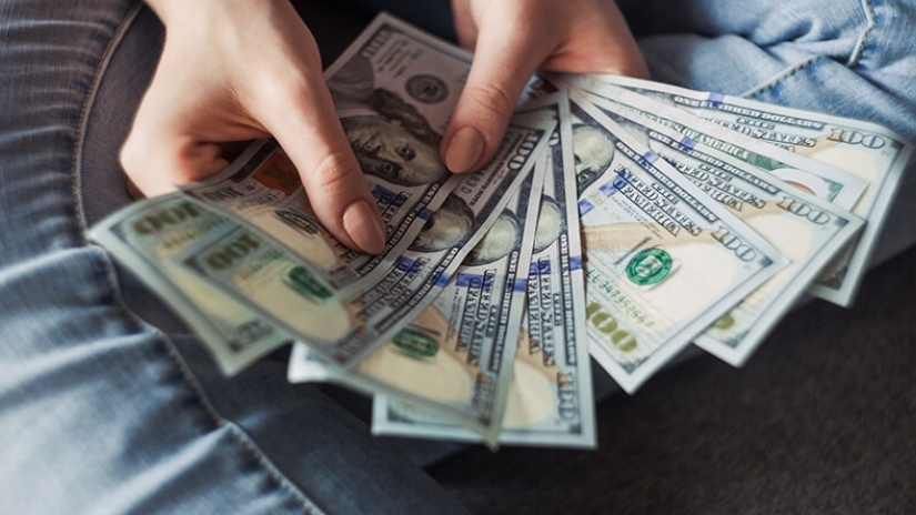 100-dollar bills spread