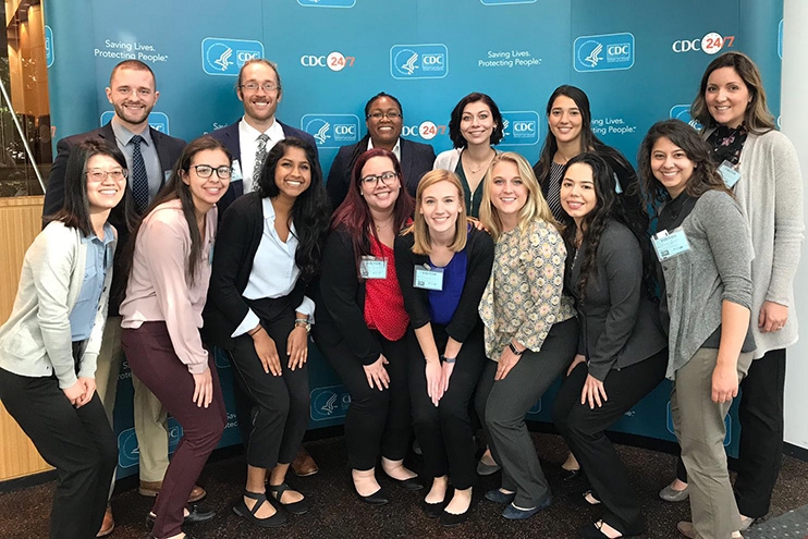 Group of students and faculty advisors at a health conference