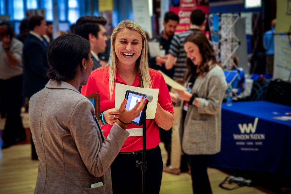 A student and recruiter chat during a careers event