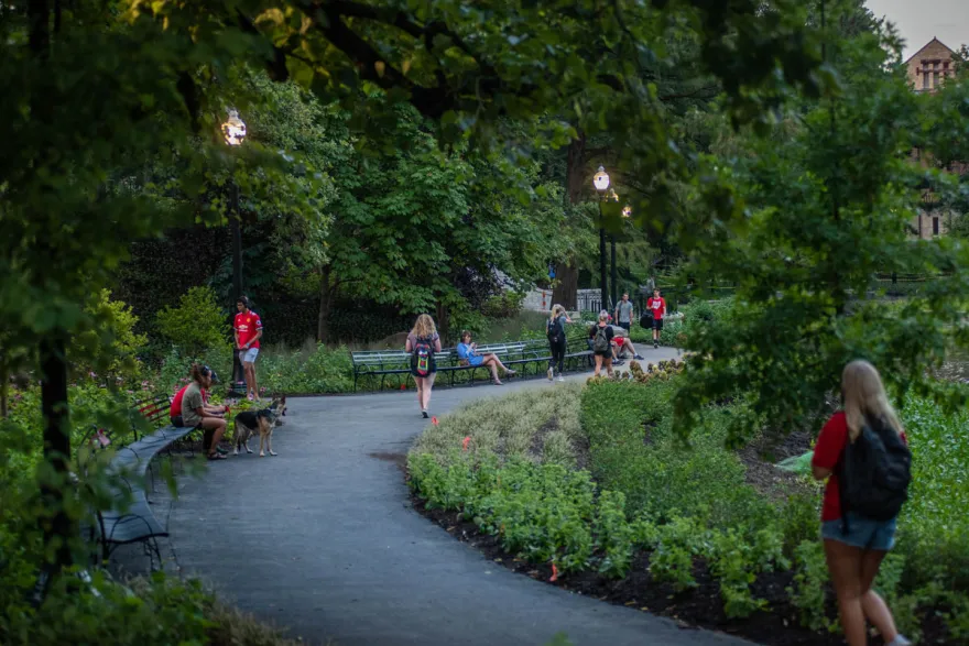 Students walk along Mirror Lake on Ohio State's Columbus campus