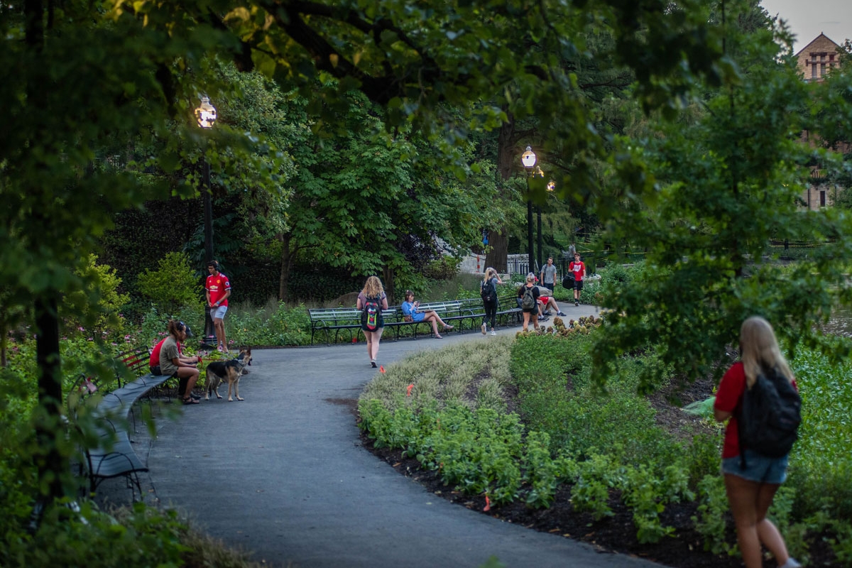 Students walk along Mirror Lake on Ohio State's Columbus campus