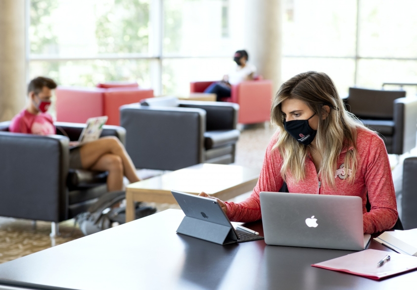 students wearing masks in library