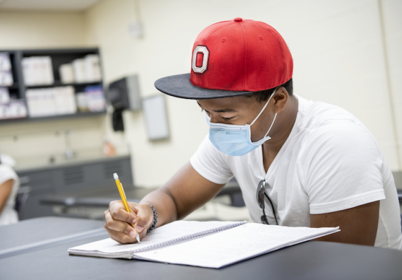 student studying wearing mask