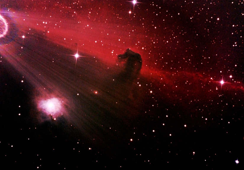 photo of the Horsehead Nebula (also known as Barnard 33). The Horsehead Nebula is a dark nebula in the constellation Orion and is approximately 1,500 light-years from Earth. Though difficult to see visually, it is one of the most identifiable nebulae because images of its swirling cloud of dark dust and gases bear remarkable resemblance to a horse's head when viewed from Earth.