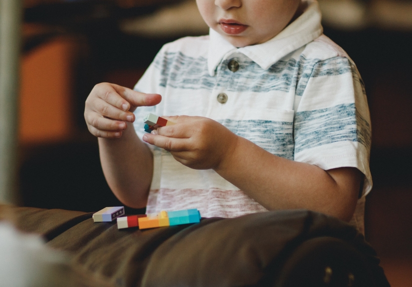 Child playing with legos