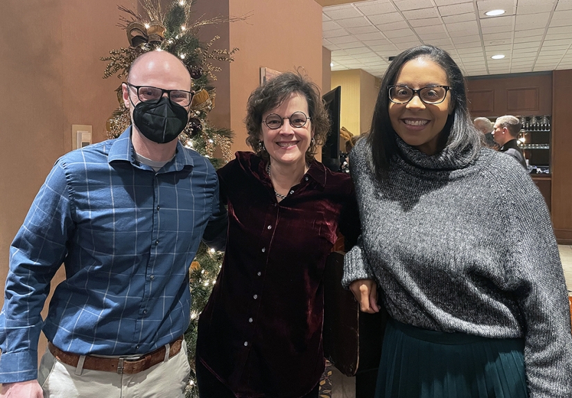 Scot Erbe, Amy Fairchild and Ashley Felix smile for a photo.