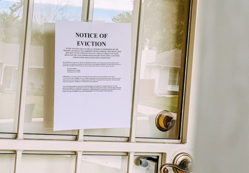 Eviction notice posted on a closed door