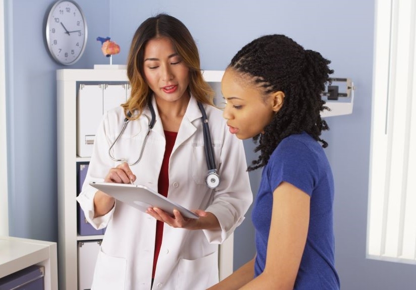 a woman discussing with her doctor