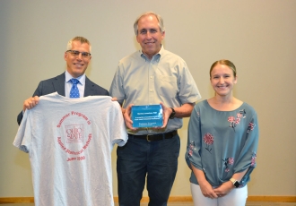 Stanley Lemeshow (center), professor of biostatistics and founding dean of CPH, received an award by CPHP director Andy Wapner and program manager Colleen Fitzgibbons.   