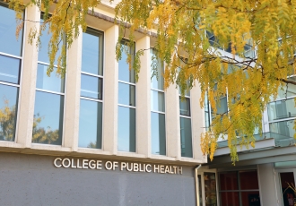 The facade of Cunz Hall with yellow leaves in the foreground 