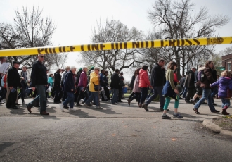 CHICAGO, IL - APRIL 14: Marchers, led by Cardinal Blase Cupich, walk through the Englewood neighborhood calling for an end to the violence that has plagued the city on April 14, 2017 in Chicago, Illinois. The marchers stopped several times to reflect on the Stations of the Cross and to read out the names of Chicago homicide victims. With 14 homicides so far in 2017, Englewood is one of the most violent neighborhoods in the city. (Photo by Scott Olson/Getty Images)  